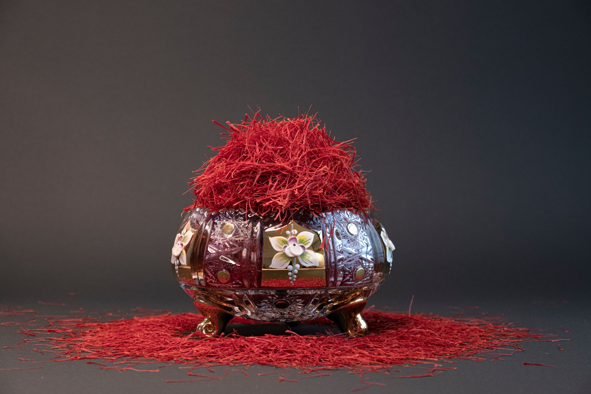 Persian saffron in a crystal dish and dark background